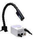 Preview: The image shows a device with a flexible neck attached to a base. At the end of the neck, there is a small lamp or camera directed at a work surface.