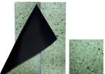 Preview: The image shows two rectangular plates. One is green with small, dark specks. The other is black and is partially covered by the green plate.