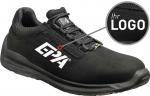 Preview: The image shows a black shoe with a simple design. On the side, there is a large, white logo. The shoe features a sporty sole and a padded upper.