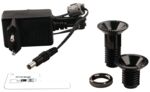 Preview: The image shows a black charger with cable and two black screw plugs. Alongside is a flat, transparent plastic measuring device.