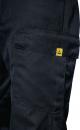 Preview: The image shows a section of a black work pants. On the side is a large, patch pocket with a yellow logo that displays a stylized shape.