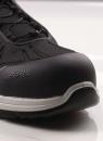 Preview: The image shows the front part of a black shoe with a sturdy rubber sole and a reinforced toe. The shoe has a textile upper and laces.