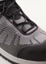 Preview: The image shows a sporty shoe in gray and black with breathable mesh material. The laces are black, and the sole is slightly raised.