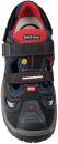 Preview: The image shows a black sports shoe with blue and red accents. It features two wide Velcro straps, a textured sole, and a breathable construction.