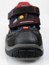 Preview: The image shows a black sports shoe with Velcro fastenings and red details. The sole is sturdy with a deep tread, ideal for outdoor activities.