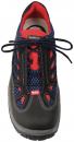 Preview: The image displays a sports shoe. It is primarily black with red and blue accents. The shoelaces are black, and the shoe features a thick, grippy sole. The design appears functional and modern.