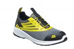 Preview: The shoe is a gray sneaker with yellow accents. It has a sporty design, a textured surface, and a black, reinforced toe cap. The laces are in the center.