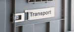 Preview: The image shows a gray transport box with a metallic clasp. On a plate, the word 
