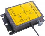 Preview: The image shows a rectangular, black device with a yellow sticker. On the sticker are diagrams and labels. A cable leads from the side of the device.