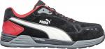 Preview: The shoe is a sporty sneaker in black with red and white accents. It has a flat sole, a padded tongue, and the brand 