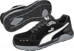 Preview: The image shows black sports shoes with gray and white details. The sole is sturdy with a non-slip pattern. They have laces and the brand 