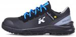 Preview: The shoe is black with blue shoelaces. The sole is robust and textured. A white logo print adorns it. The shoe has a reinforced toe cap for protection.