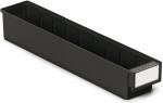 Preview: The image shows a long, narrow container in black with several compartments. On one side, there is a transparent area, likely for labeling.