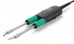 Preview: The image shows a soldering iron with two metallic tips and green rubber grips. The handle is black and has a connecting cable. It is used for soldering.