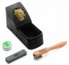 Preview: The picture shows a cleaning kit: a black box with golden contents, a green tube, a gray sponge, and a wooden brush with metal bristles. All parts are arranged on a white background.