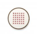 Preview: The image shows a round, flat surface with a white inner area containing 16 small, red squares in a 4x4 pattern. The outer edge is brown.