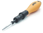 Preview: The image shows a screwdriver with an orange, ergonomic handle and a black shaft. At the tip is a replaceable blade that is flat and narrow.