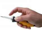 Preview: A hand holds a screwdriver with a yellow handle. The tip is slim and made of metallic material. The handle has a non-slip surface.