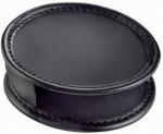 Preview: The image shows a round, flat object made of black material. It has a slightly raised edge and an opening on the side. The surface is smooth and shiny.