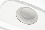 Preview: The image shows a round, circular opening in a white surface. The edge is slightly raised and smooth. The center is transparent and reveals the space underneath.
