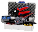 Preview: The image shows an open toolbox with various tools. Inside are pliers with red-blue handles and several compartments with colored wire terminals in red, blue, and white.