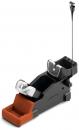 Preview: The image shows a ski binding with an orange, compact base and a black mount. At the top are two fasteners securing the ski boot system. A cable protrudes.