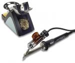 Preview: The image shows a soldering iron set: A soldering iron with a black handle and metal tip, connected by a cable. Next to it is a stand with a sponge and a small metal brush for cleaning.