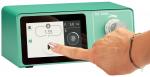 Preview: The image shows a green device with a touchscreen. A hand is touching the screen. On the display, numbers and symbols are visible that indicate various settings.