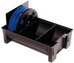 Preview: The image shows a black box with two compartments. In one compartment, there is a large blue spool with a black edge. The box has side handles and is sturdily designed.