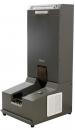 Preview: The image shows an automatic shoe cleaning machine made of dark metal. At the top, there is a narrow slot, and below it is a wider area with a brush. On the side, there is a control button and a vent.