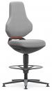 Preview: The chair has a high backrest and a padded seat in light gray. It stands on a sturdy, swivel base and has a round footrest. An orange accent is visible.