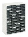 Preview: The image shows a compact storage cabinet with several small, dark drawers. It has a rectangular shape and is made of light material.