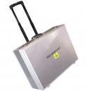 Preview: The picture shows a silver suitcase with a telescopic handle, standing on wheels. On the front, the inscription 